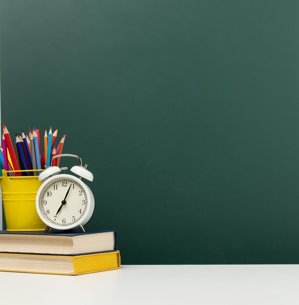 Close-up of clock on table against wall