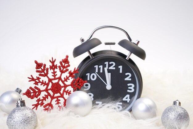 Close-up of clock on table against white background