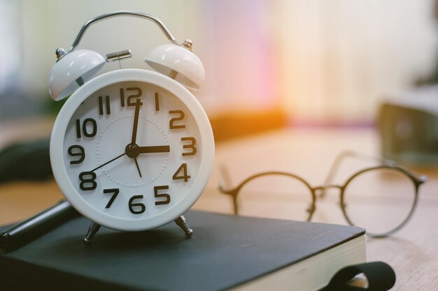 Close-up of clock on table at home