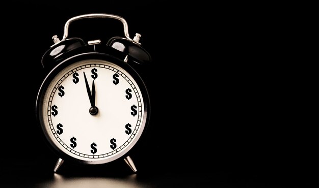 close-up of clock tower against black background