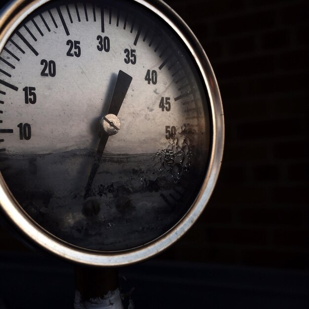 Close-up of clock on wall