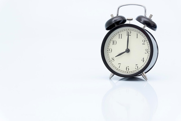 Close-up of clock over white background