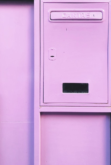 Photo close-up of closed pink mailbox