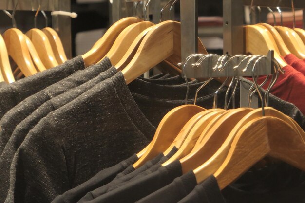 Close-up of clothes hanging on rack in store