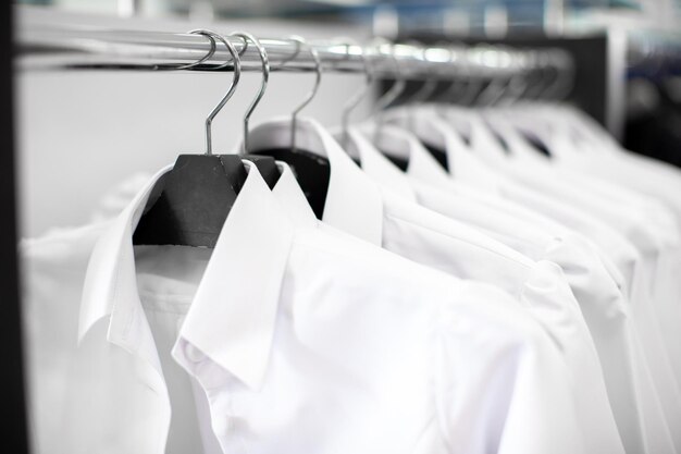 Close-up of clothes hanging on rack in store