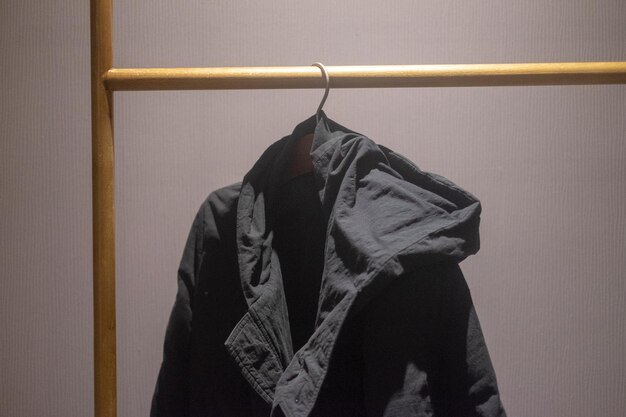 Photo close-up of clothes hanging on wall