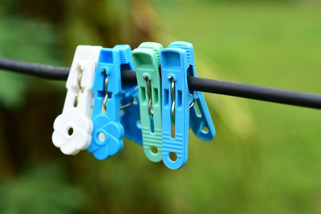 Close-up of clothespins hanging on clothesline