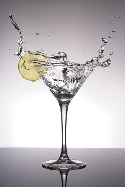 Close-up of cocktail on table against white background