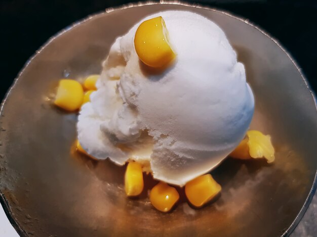 Close-up Coconut Milk Ice Cream with Corn Seeds Topping