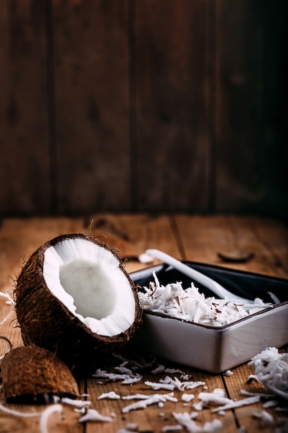 Close up of a coconut on wood