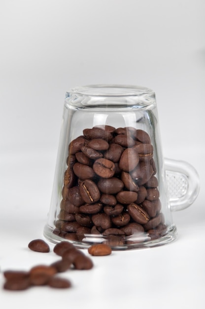 Close-up of coffee beans in glass jar on table