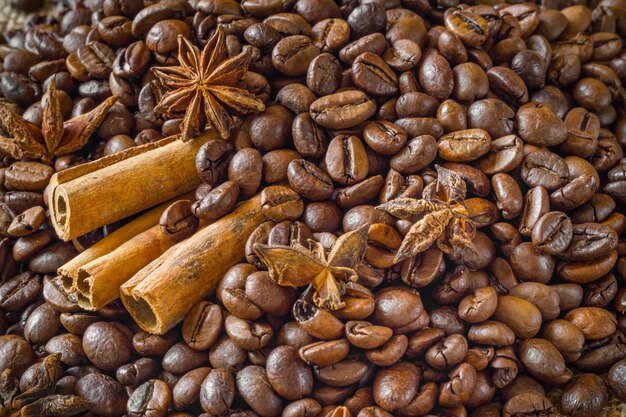 Close-up of coffee beans with star anise and cinnamon.