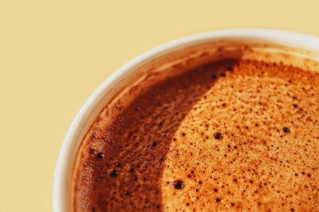 Close-up of coffee cup against white background