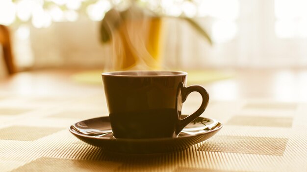 Close-up of coffee cup on table