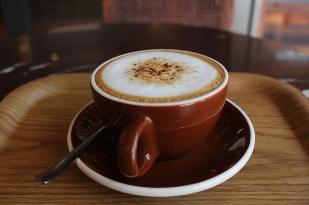 Close-up of coffee cup on table