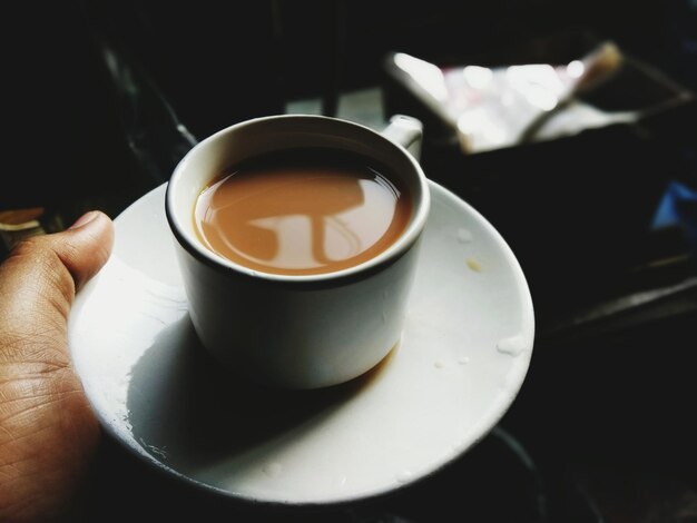 Close-up of coffee cup on table