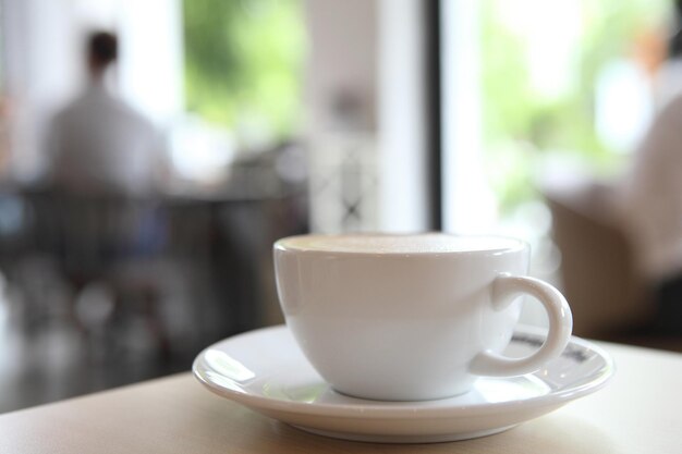 Close-up of coffee cup on table