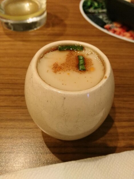 Close-up of coffee cup on table