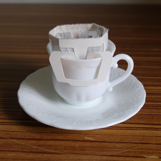 Close-up of coffee cup on table