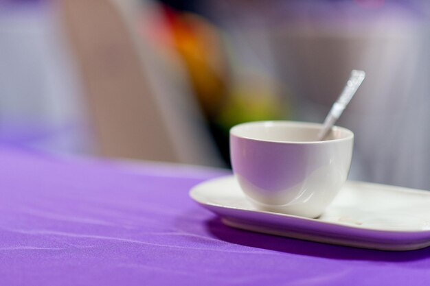 Close-up of coffee cup on table