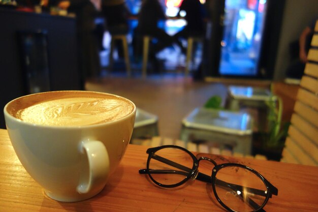 Close-up of coffee cup on table