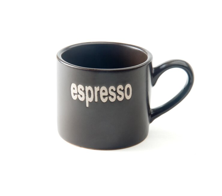 Photo close-up of coffee cup with text against white background