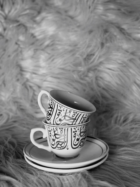 Premium Photo | Close-up Of Coffee Cups On Fur