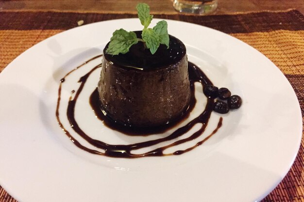 close-up of coffee flan served in plate