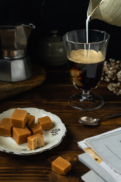 Close-up of coffee glass with some salted caramel fudge