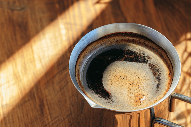 close up of coffee in metal turk
