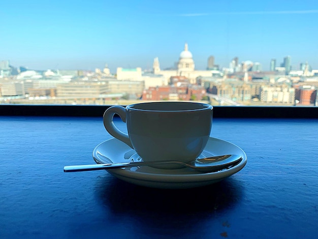 Close-up of coffee on window sill