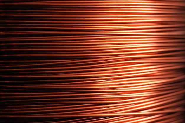 Photo close-up of a coil of red copper wire