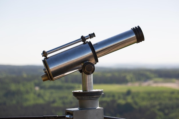 Close-up of coin-operated binoculars against clear sky