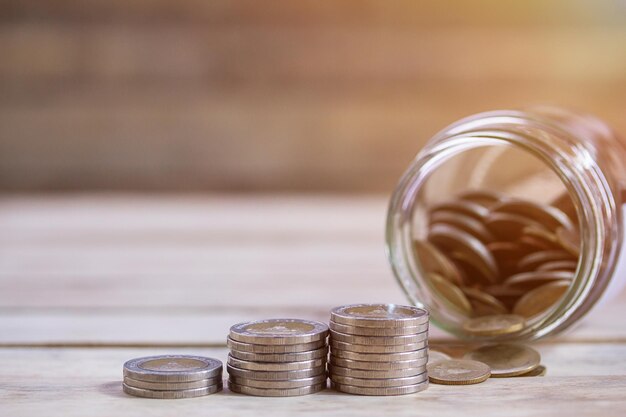 Close-up of coins in jar on table