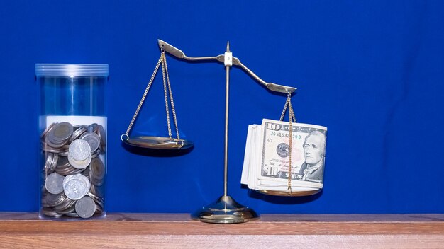 Close-up of coins on table against wall