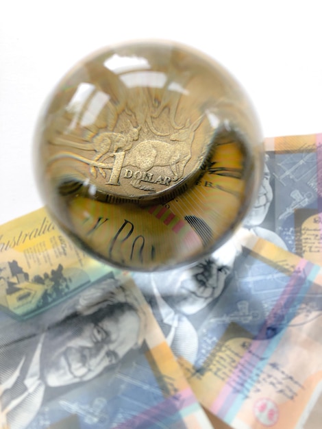 Close-up of coins on table against white background