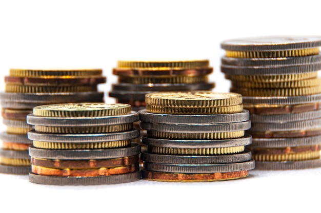 Close up of coins on white background with customizable space for text or ideas Copy space