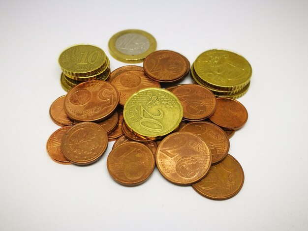 Close-up of coins on white background