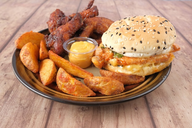 Close up of collection of junk food on plate on table