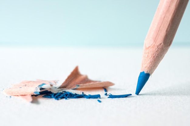 Close-up of colored pencils against white background