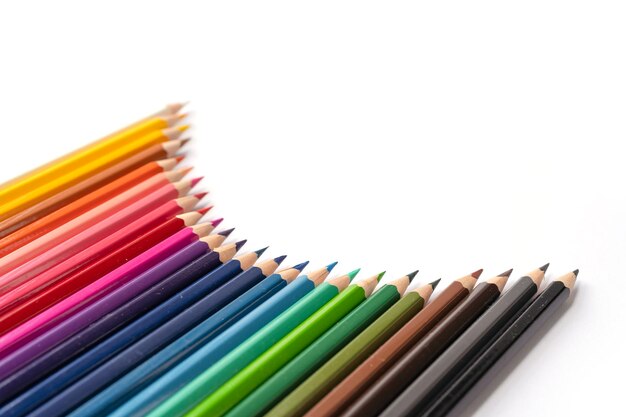 Close-up of colored pencils against white background