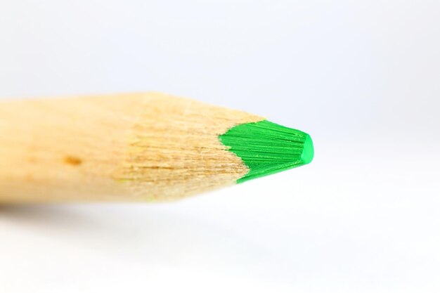 Close-up of colored pencils against white background