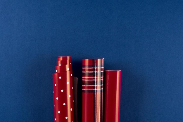 Close-up of colored pencils on table against blue background