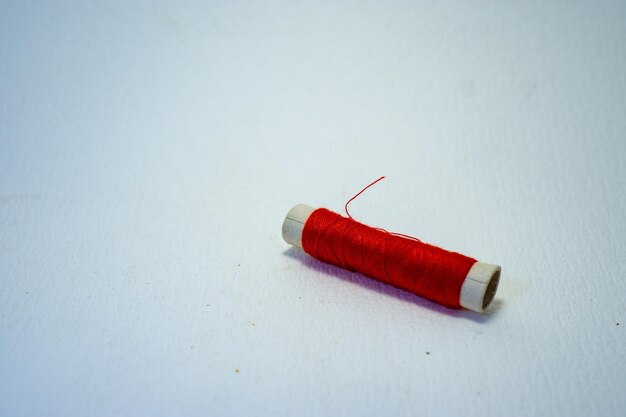 Close-up of colored pencils on table against white background