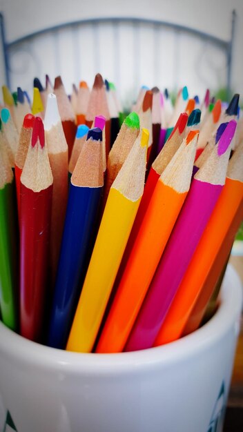 Close-up of colored pencils on table