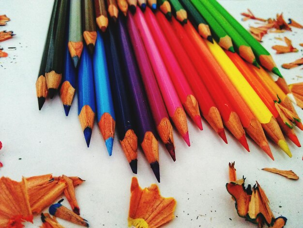 Close-up of colored pencils with shavings