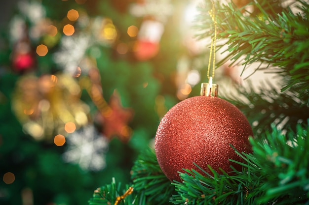 Close up of Colorful balls on Green Christmas tree background Decoration During Christmas and New Year.