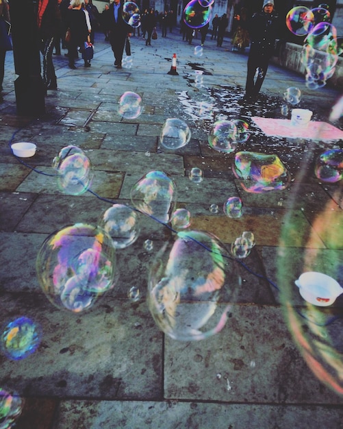 Photo close-up of colorful bubbles on street
