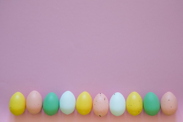 Close-up of colorful easter eggs against pink background