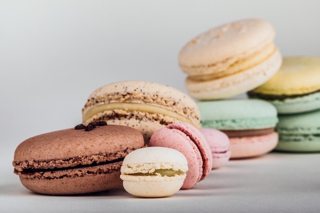 Close up colorful French or Italian macaron on wood table 